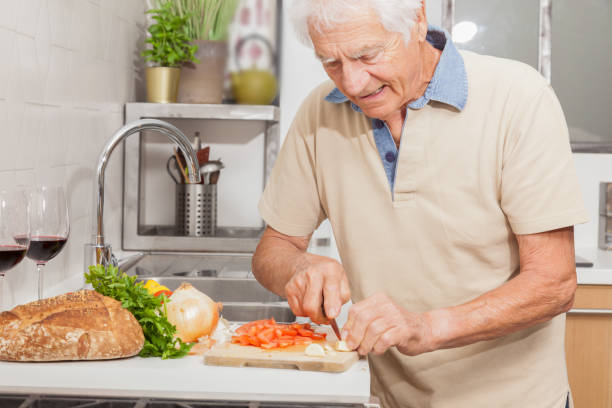 istock Senior man in a kitchen at home. 1217369999