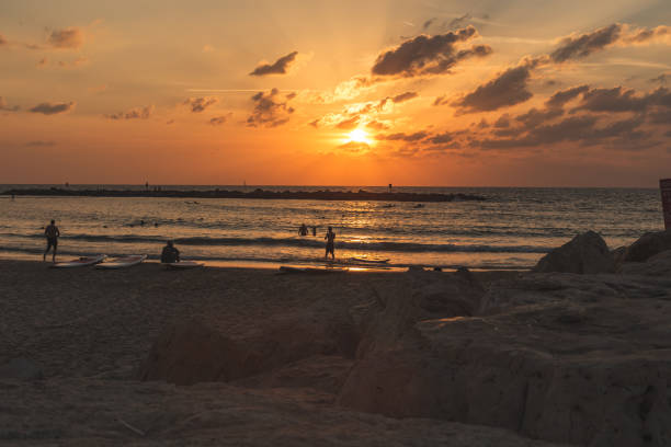 istock People on the beach during the scenic sunset 1217370012