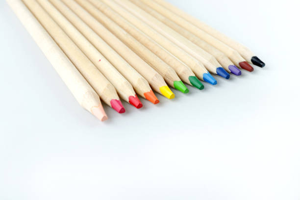 color pencils on white paper on the table