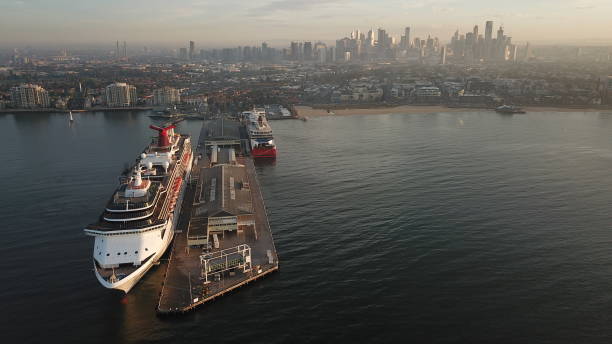 Ship on the sea Melbourne, Australia - February 6th 2019. Carnival Legend, a Spirit class cruise ship operated by Carnival Cruise Line, with the Spirit of Tasmania, a daily ferry service from mainland Australia to Tasmania, both docked at Port Melbourne. port melbourne melbourne stock pictures, royalty-free photos & images