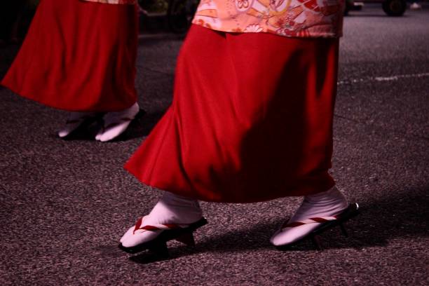 Awa Dance Festival Night shots of women performing a traditional dance in colorful kimonos and straw hats in Tokyo. japan women human foot japanese culture stock pictures, royalty-free photos & images