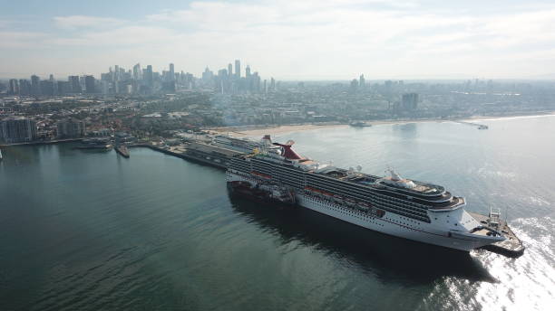 Ship on the sea Melbourne, Australia - February 6th 2019. Carnival Legend, a Spirit class cruise ship operated by Carnival Cruise Line, with the Spirit of Tasmania, a daily ferry service from mainland Australia to Tasmania, both docked at Port Melbourne. port melbourne melbourne stock pictures, royalty-free photos & images