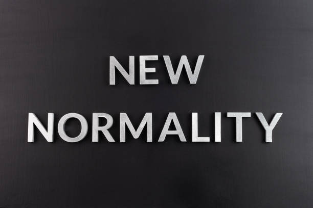 istock the words new normality laid with silver metal letters on flat black matte surface directly above in flat lay perspective 1217374064