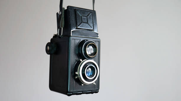 istock Vintage two lens photo camera isolated on white background. 1217374304
