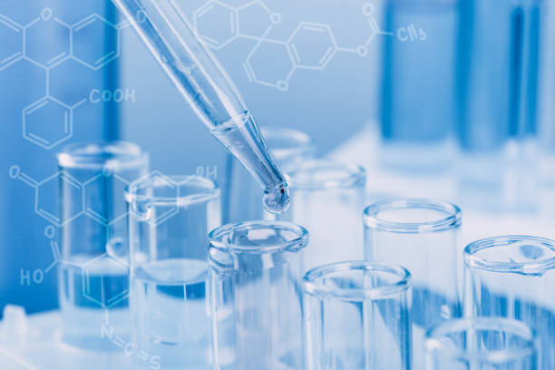 istock Laboratory glassware with a dropper dripping liquid into a test tube. scientific laboratory test tubes, laboratory equipment 1217375478