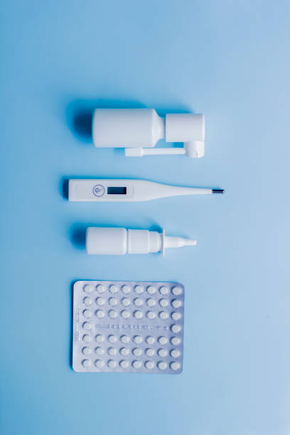 istock Medical supplies lie on a blue light background. 1217375834