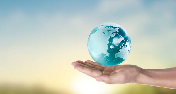 istock Globe , earth in human hand, holding our planet glowing.  image provided by Nasa 1217377841