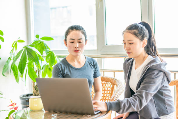 istock Two young Asian women are discussing work plans 1217380791