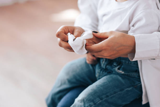 istock mom and baby rub their hands 1217381410