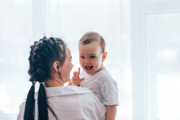 istock Young mother holding little son in her arms 1217381487