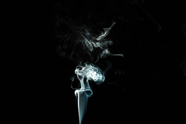 istock puffs of white smoke with a black background 1217383612