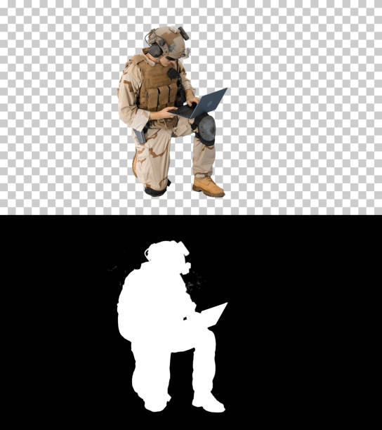 istock Soldier using laptop and Radio For Communication During Military 1217384100