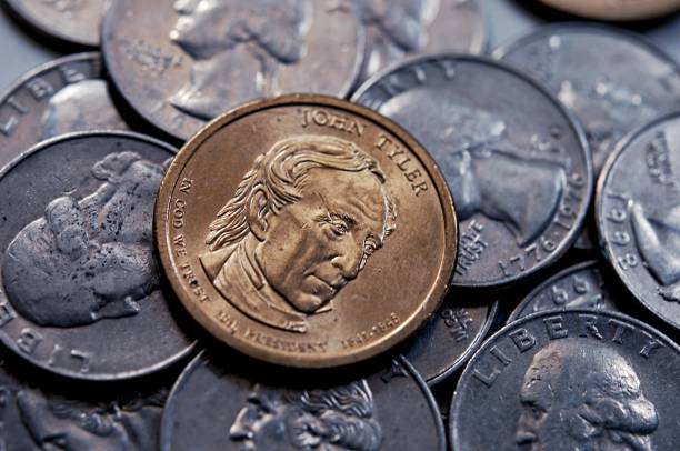istock one dollar united state coin background 1217385392