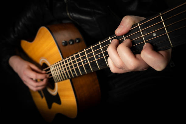 istock Playing an acoustic guitar. 1217385820