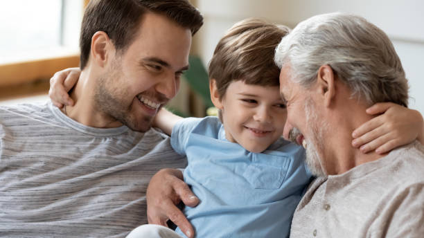 istock Happy three generations of men relax at home 1217386098
