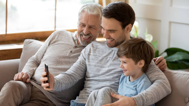 istock Three generations of men make selfie together 1217386103