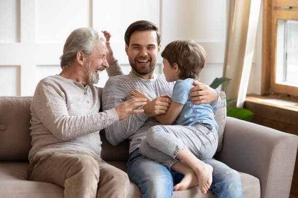 istock Happy three generations of men have fun at home 1217386115