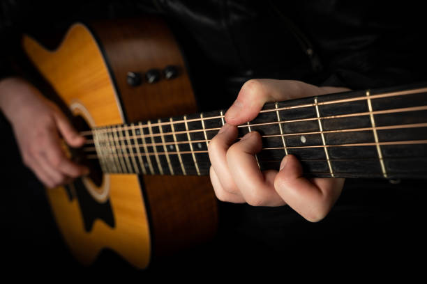 istock Playing an acoustic guitar. 1217386143