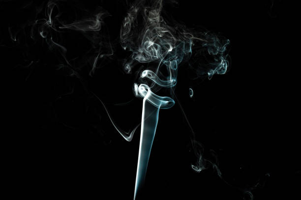 istock puffs of white smoke with a black background 1217387873