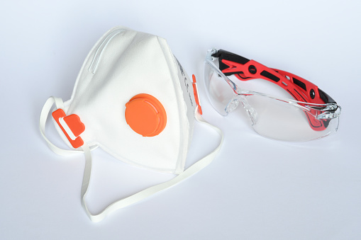 Protection Mask KN95 ffp3 with glasses against dust and corna viruses (COVIT-19) placed on a white background