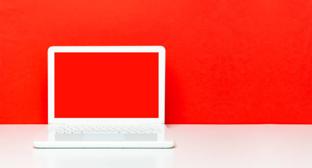 istock Red Screen Laptop On The Office Desk 1217388452