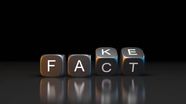 Dice blocks with flip over from FAKE to FACT word on black background