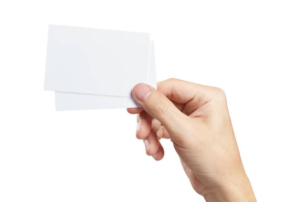 istock Hand with two pieces of paper or plastic on white 1217393451