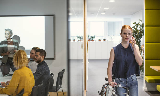 istock Businesswoman arriving to work with bicycle 1217394089