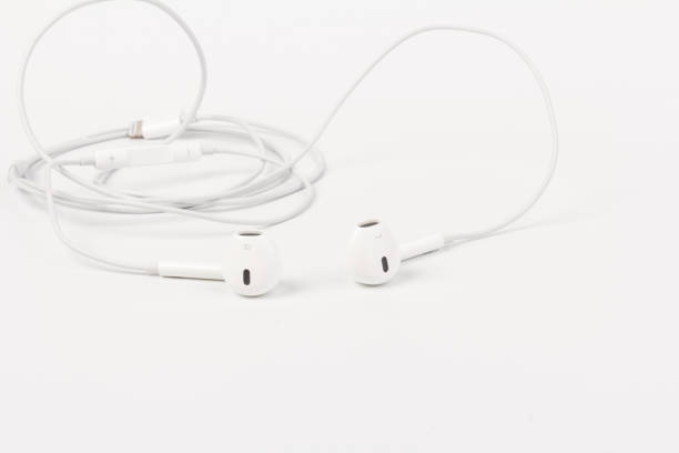 istock White headphones with headset on white isolated background 1217394547