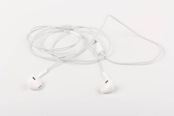 istock White headphones with headset on white isolated background 1217395150