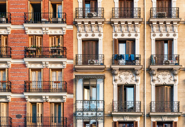 istock Looking up at building with decorative shuttered balconies 1217395281