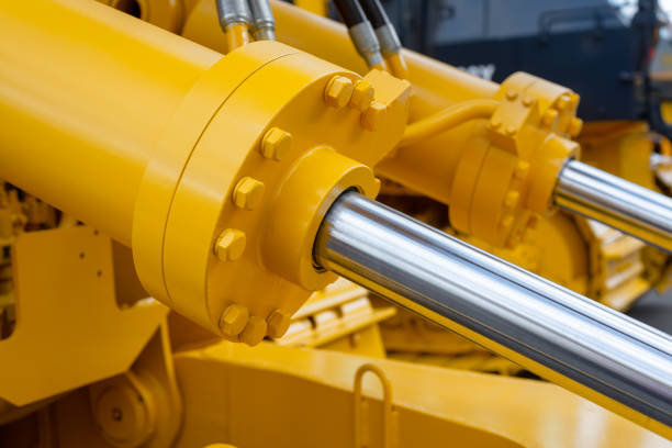 Powerful hydraulic cylinders. The main power and driving element for construction equipment Powerful hydraulic cylinders. The main power and driving element for construction equipment. hydraulic platform stock pictures, royalty-free photos & images