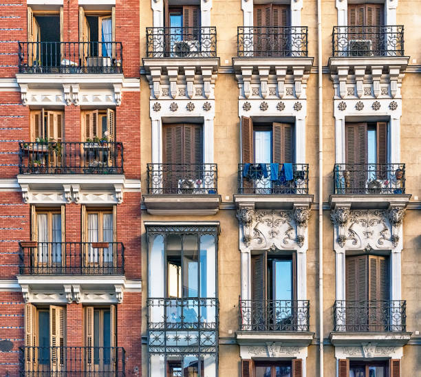 istock Looking up at building with decorative shuttered balconies 1217395953