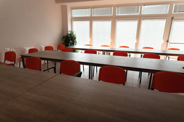 istock Empty desks and chairs in cafeteria room 1217397491