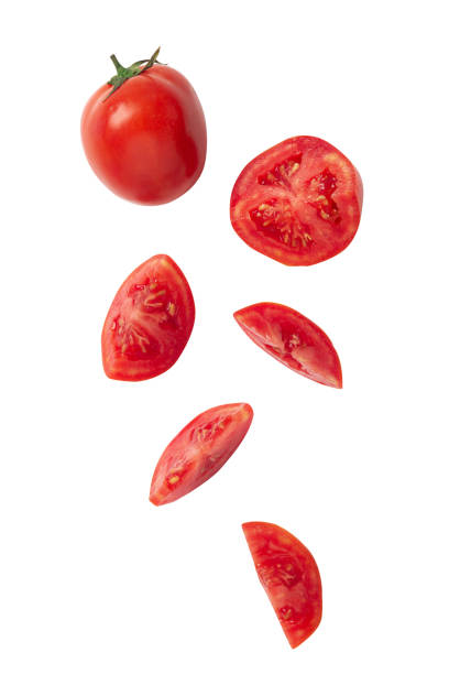 istock Falling tomato slice isolated on white background with clipping path 1217397811