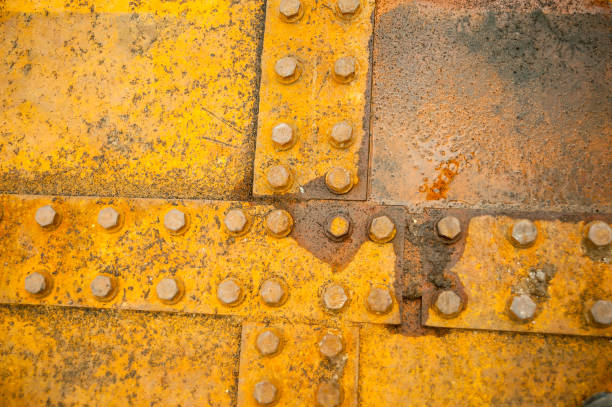 istock Rusty nut at the surface of steel plate closeup 1217398375