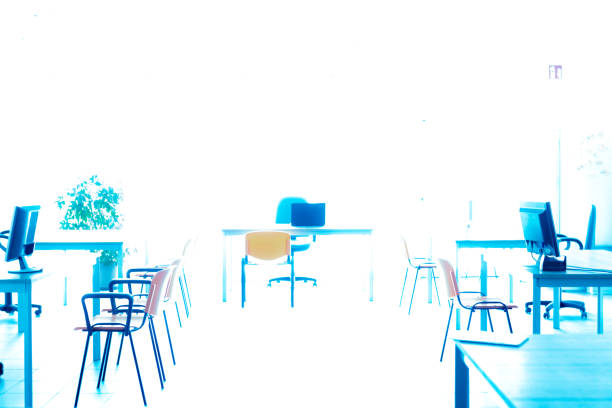 A high key empty office room with no people during the corona virus pandemic.