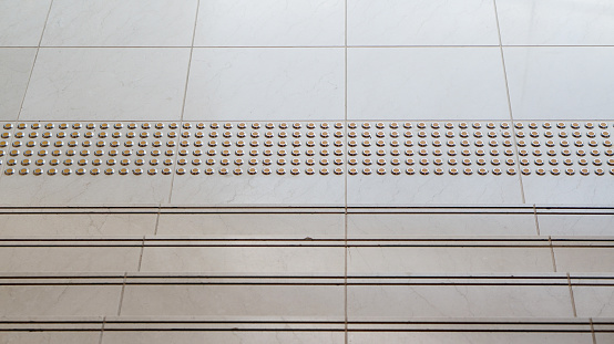 Tactile pave and non slip stair groove design architecture detail for disability and user