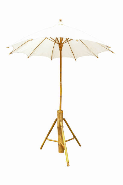 istock Handcraft umbrella made from cotton fabric and bamboo isolated on white background. 1217402282