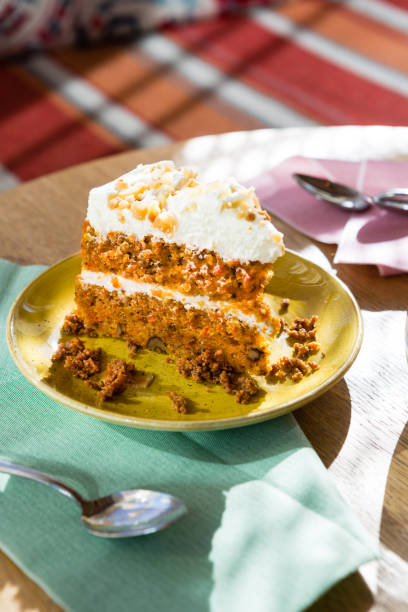 istock Delicious colored carrot cake on a wood table 1217404351