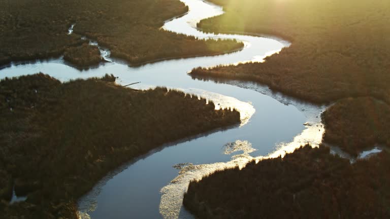 Rising Sun Shining on Water of Pascagoula River Delta, Mississippi