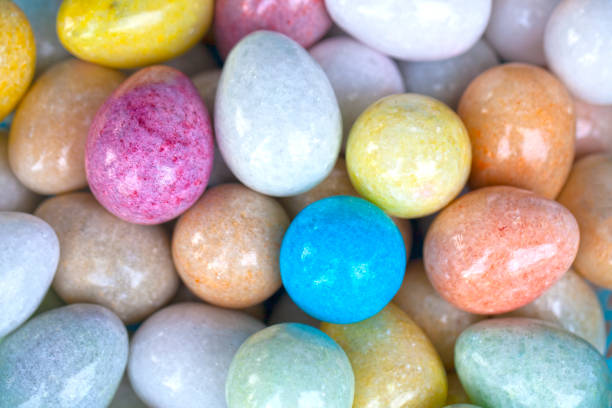 istock Easter background, natural marble eggs, different colors, Colorful background of onyx (marble) stone eggs. 1217409873