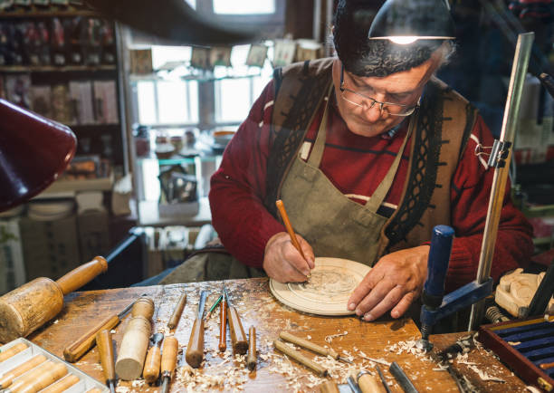 istock Senior artist working at his atelier 1217413469