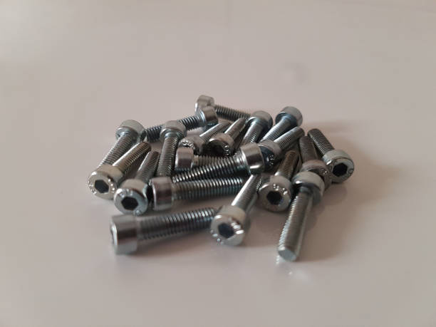 istock Thin allen head screws on the white floor, close-up shot 1217414130