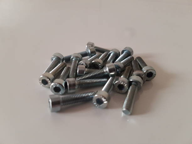 istock Allen head screws and nuts, close-up shot, white background 1217414878