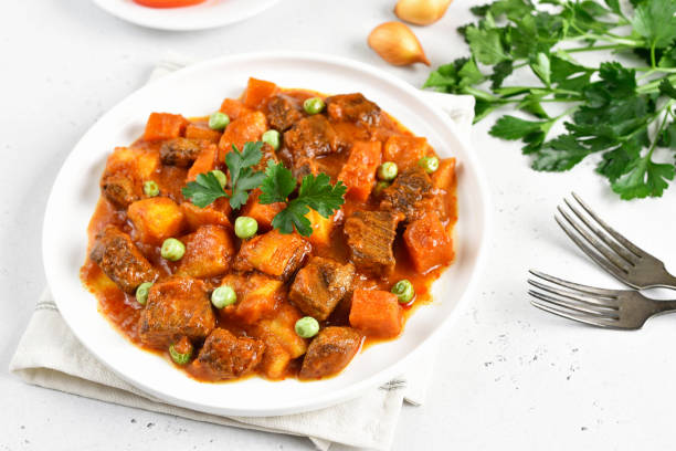 istock Beef stew with potatoes and carrots in tomato sauce 1217414975