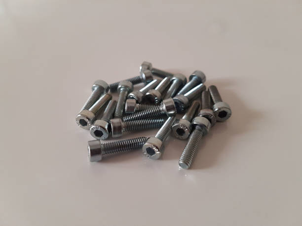 istock Thin allen head screws on the white floor, close-up shot 1217415067