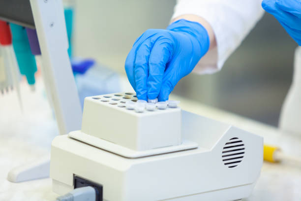 istock Laboratory worker puts samples into a tray making analysis for immunity viruses in a medical laboratory. COVID-19. COVID Coronavirus 1217416334