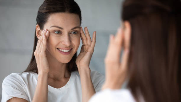 istock Happy client satisfied with eyes area condition after spa procedure. 1217416367