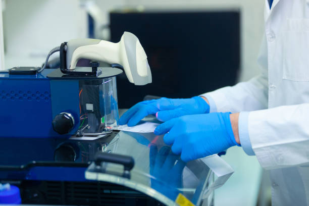 istock DNA laboratory. The expert puts the human DNA into the database using advanced laboratory technologies 1217416373